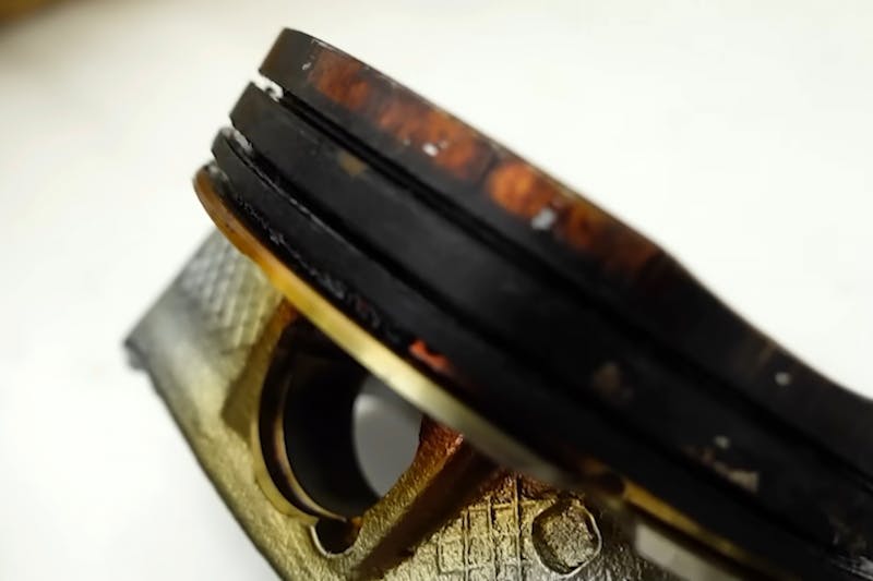 Piston covered in burnt oil
