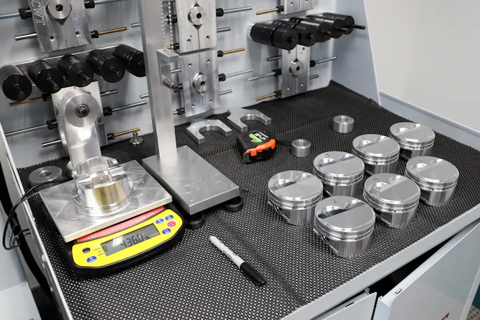 weighing drop-in pistons