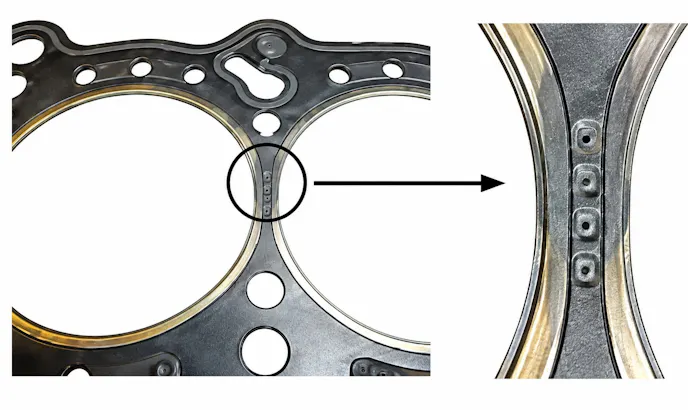 Gasket image is from the Elring catalog describing failure due to gas blow-by. The gasket was not compressed sufficiently in the destroyed section because non compliance with a specified bolt tightening torque Presumably because the old cylinder head bolts were used resulting in gas blow-by, overheating and the destroyed sealing web.